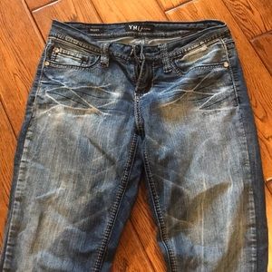 Medium wash. Bedazzled pocket skinny jeans. Size 3